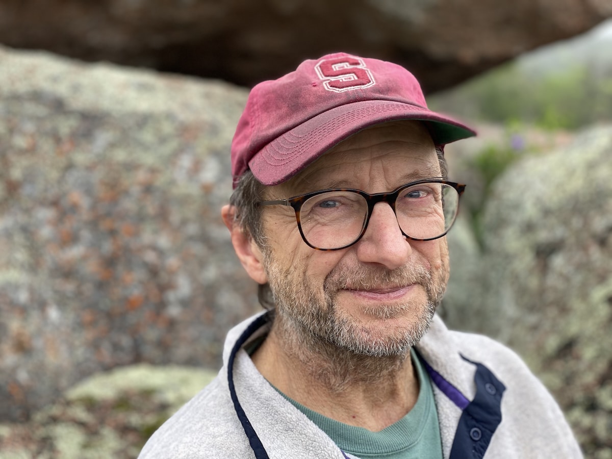 picture of Frederick Speers taken selfie stlye of a man with a blue plaid shirt, glasses, and facial hair